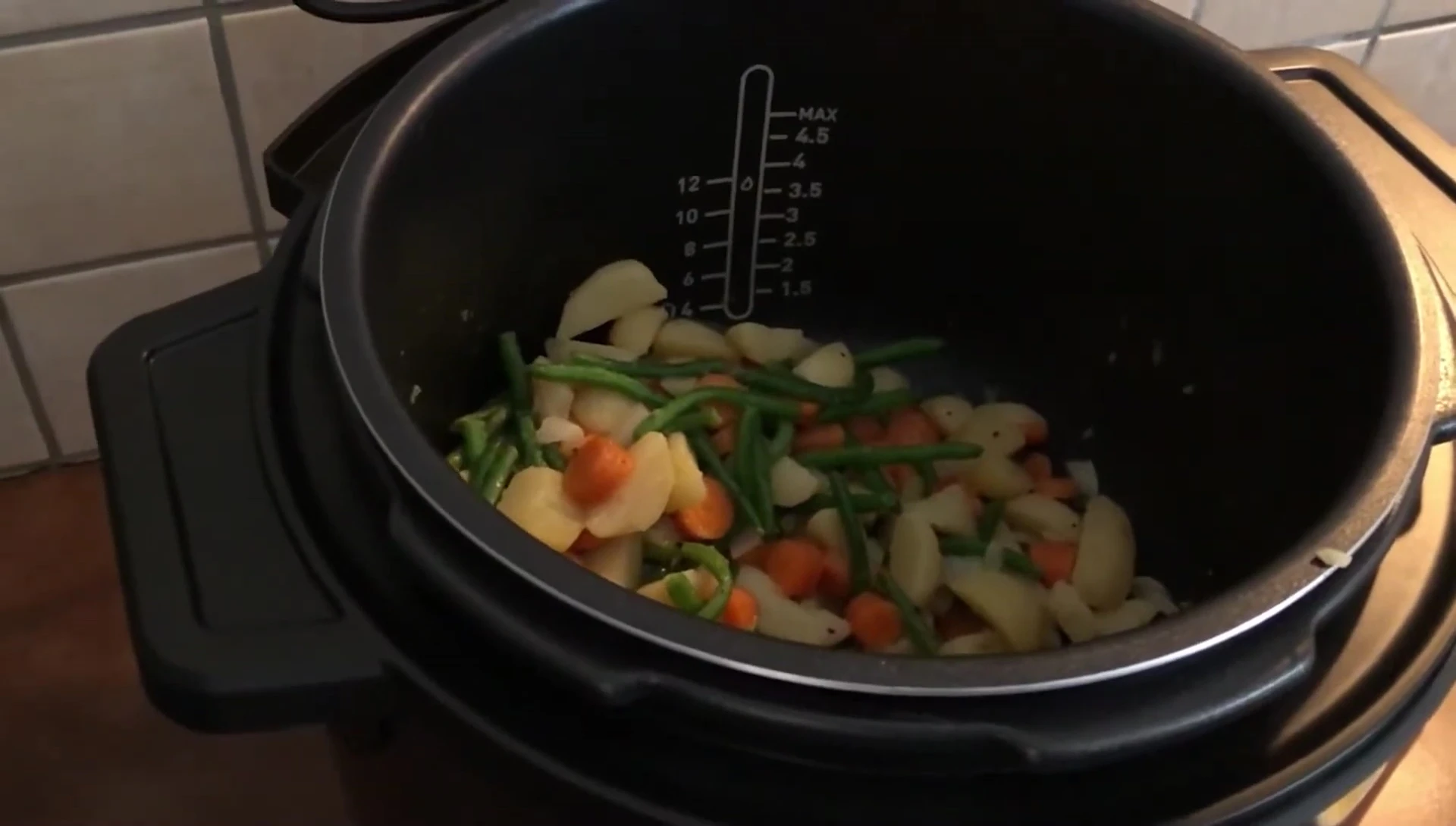 Sautéed vegetables cooking in a multi-cooker.