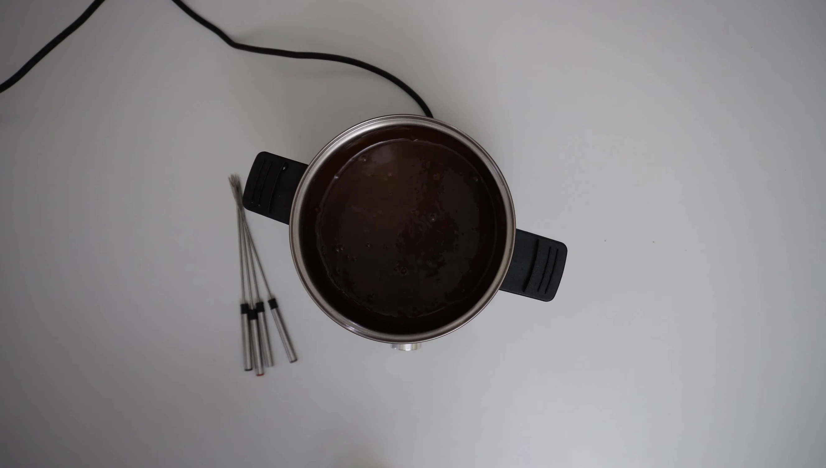 Chocolate fondue pot with forks