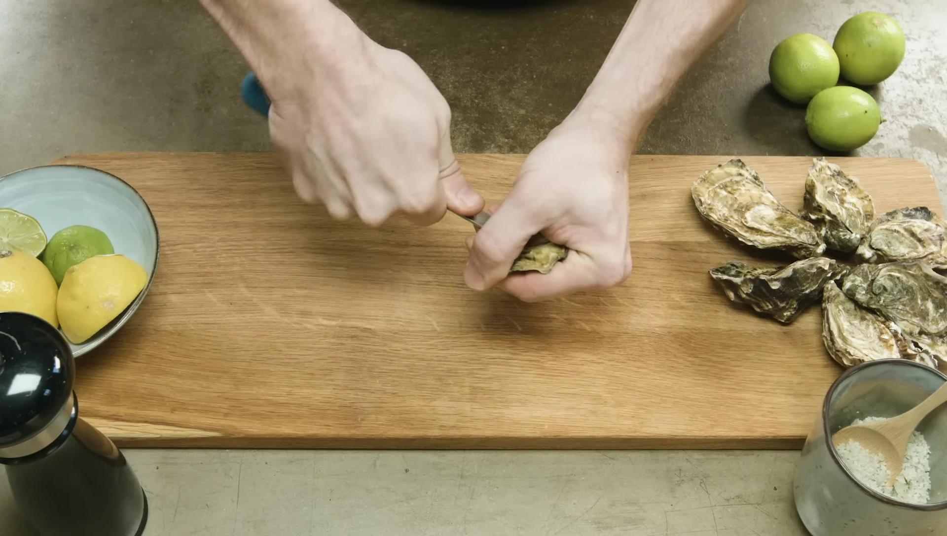 Shucking oysters with a small knife