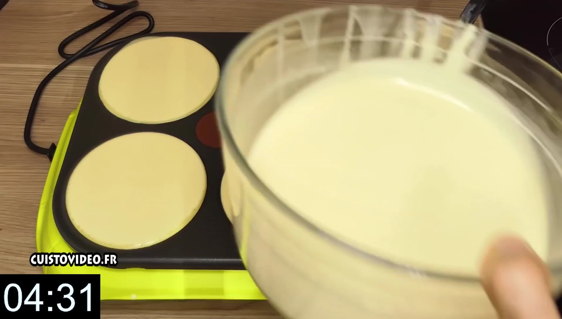 Pancake batter poured onto electric crepe maker