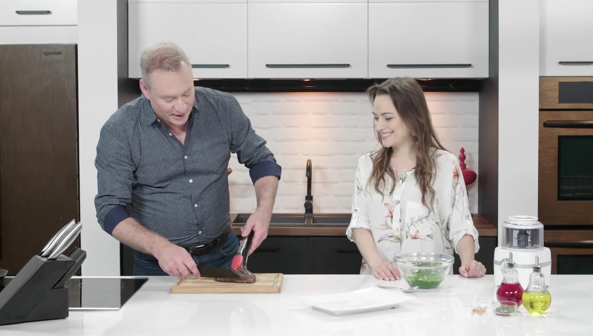 Chef slicing cooked beef with knife